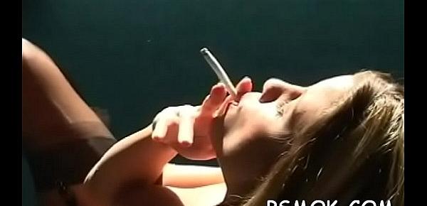  Elegant hottie smokes a cig